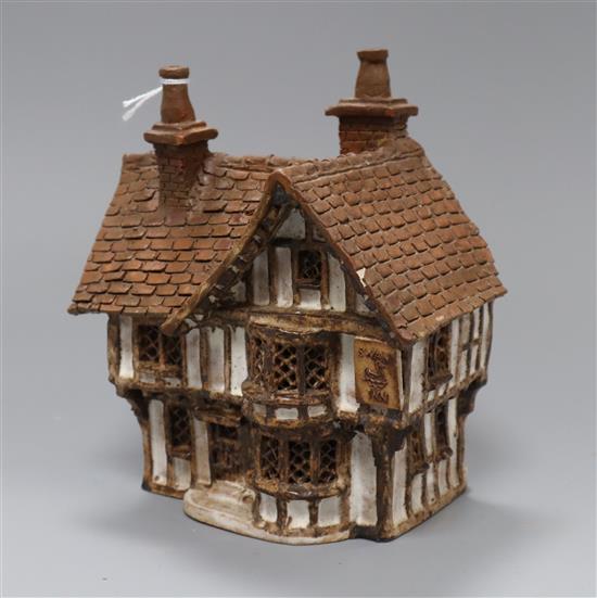 A studio pottery model of a cottage 19cm high